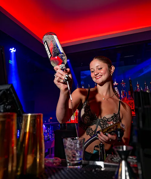 Bartender mixing drinks